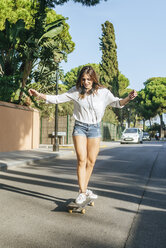 Young woman balancing on skateboard - KIJF01759