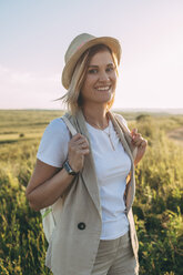 Blond woman wearing hat in summer, female hiker - VPIF00266