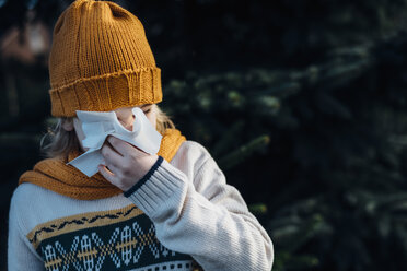 Little boy having a cold, blowing his nose - MJF02218