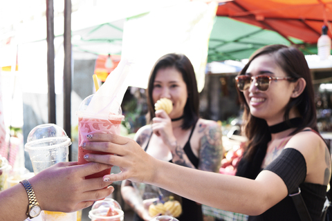 Woman buying a smoothie from a street vendor in Thailand stock photo