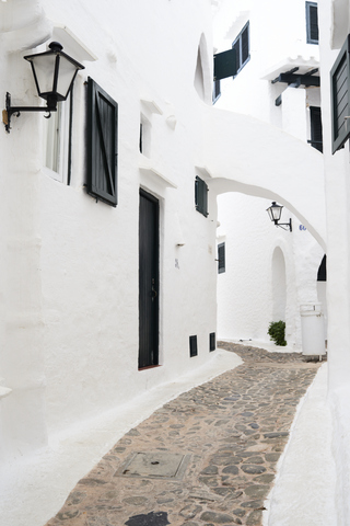 Spain, Menorca, Binibequer Vell, white traditional small village, alley stock photo