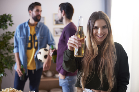 Friends relaxing with beer and snacks stock photo