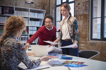 Colleagues brainstorming at a meeting in creative office - WESTF23790