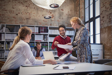 Colleagues brainstorming at a meeting in creative office - WESTF23792