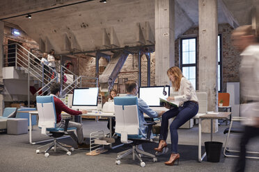 People working in big modern office - WESTF23880