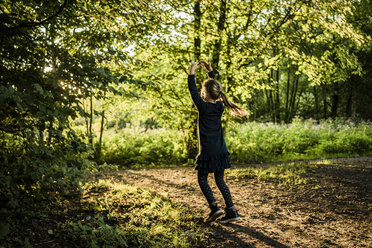 Rear view of girl in a forest - MOEF00574