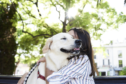 Young woman hugging her dog stock photo