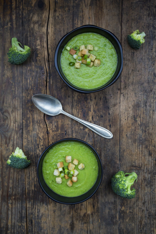 Broccoli soup in bowl, croutons stock photo