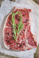 Raw beefsteak with rosemary, salt and pepper - GIOF03686