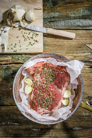 Row beefsteak with herbs and garlic stock photo