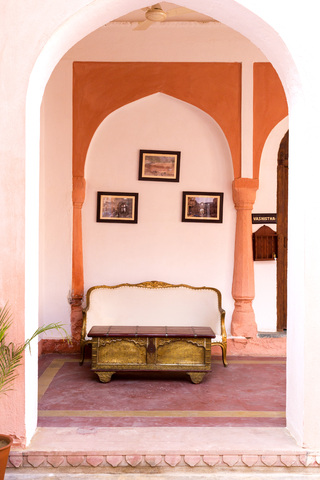 India, Rajasthan, Alwar, Heritage Hotel Ram Bihari Palace, Sofa and old table stock photo