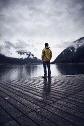 Austria, Tyrol, Lake Achen, man standing on boardwalk - RBF06231