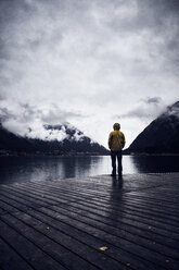 Austria, Tyrol, Lake Achen, man standing on boardwalk - RBF06232