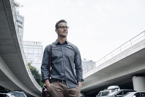 Portrait of young businessman outdoors stock photo