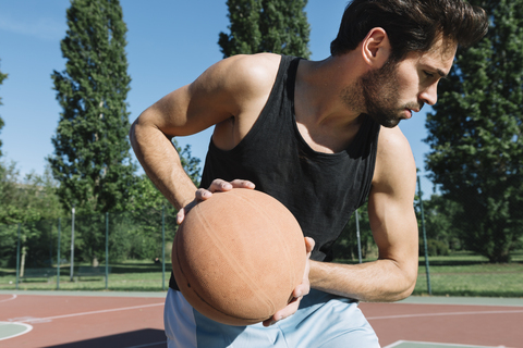 Man playing basketball stock photo