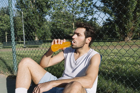 Basketball player drinking from bottle stock photo