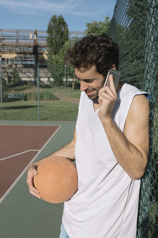 Basketball player on the phone stock photo