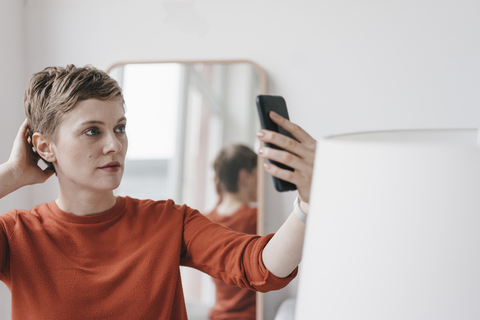 Portrait of woman holding cell phone stock photo