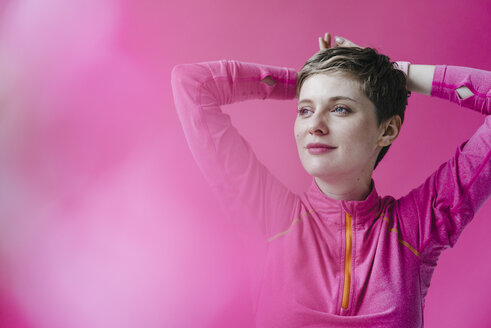 Portrait of woman in pink sportswear - KNSF03319