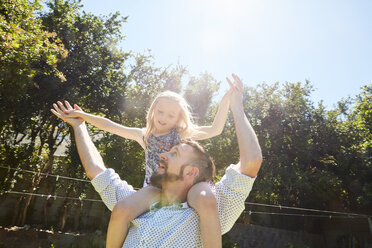 Happy father carrying daughter on shoulders - SRYF00644