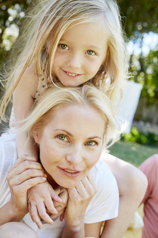 Portrait of happy girl with mother outdoors stock photo