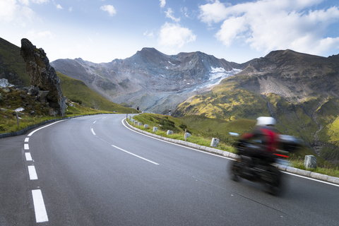 Austria, Salzburg State, biker on Grossglockner High Alpine Road stock photo