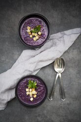 Bowl of red cabbage soup garnished with croutons - LVF06569