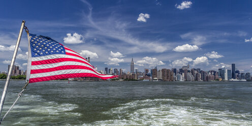 USA, New York, East River, American Flag, View to Midtown Manhattan - JHEF00043