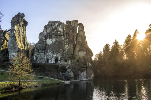 Germany, North Rhine-Westphalia, Horn-Bad Meinberg, Teutoburg Forest, Externsteine against the sun stock photo