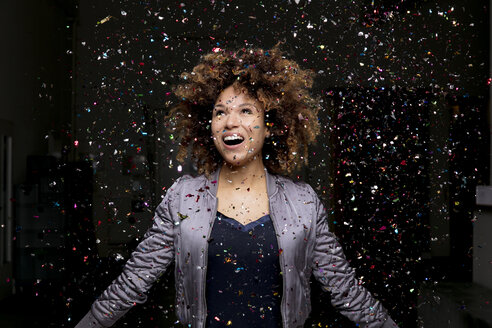 Confetti falling on amazed woman - HHLMF00023