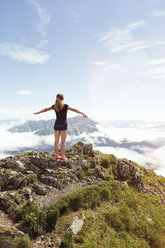 Austria, South Tyrol, female hiker, teenage girl arms outstretched - FKF02862