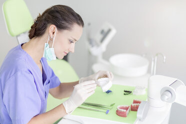 Dental technician working at dental imprint - MMAF00212