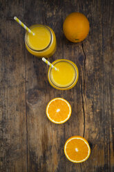 Freshly squeezed orange juice in jars with straws - LVF06575