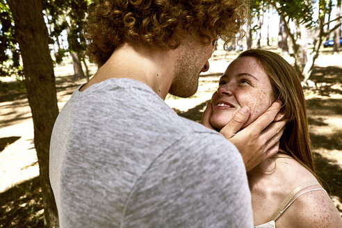 Happy young couple in love in forest - SRYF00723