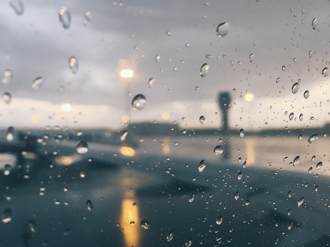 Raindrops through airplane window. Sofia, Bulgaria. stock photo