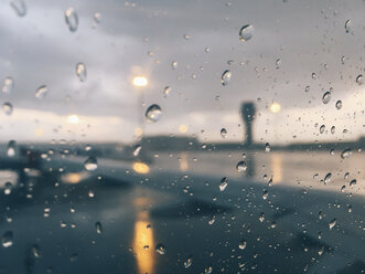 Raindrops through airplane window. Sofia, Bulgaria. - BZF00376