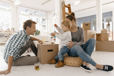 Happy family moving into new home - KNSF03392