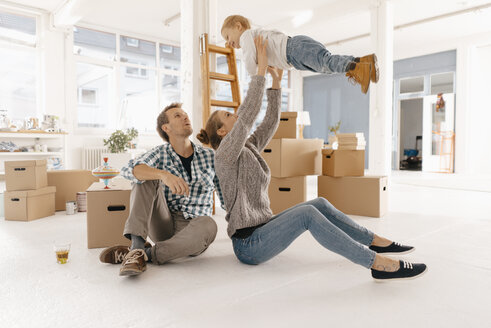 Happy family moving into new home - KNSF03395