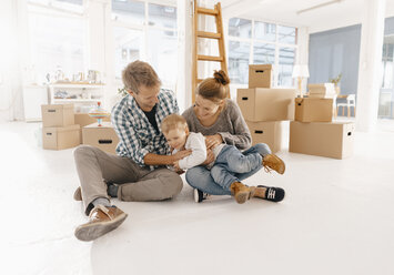 Happy family moving into new home - KNSF03401