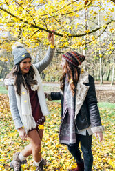 Two pretty women having fun in an autumnal forest - MGOF03723
