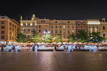 Poland, Krakow, Old town, town houese at main square by night - CSTF01586