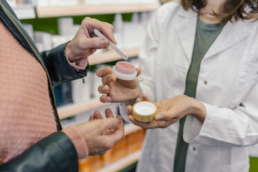 Customer testing cosmetics in pharmacy - MFF04293