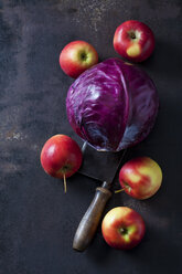 Red cabbage, apples and cleaver on rusty ground - CSF28717