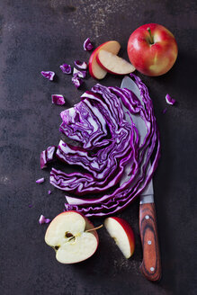 Sliced and red cabbage and apples on rusty ground - CSF28718