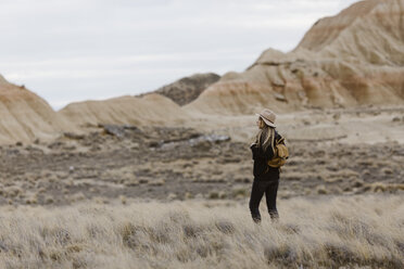 Woman standing in barren landscape - JPF00301