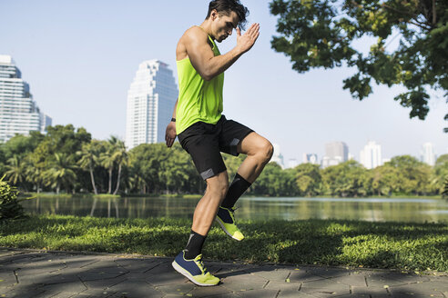 Runner warming up in urban park - SBOF01137