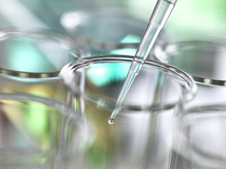 Sample being pipetted into test tubes during a laboratory experiment - ABRF00001