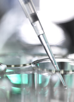 Sample being pipetted into test tubes during a laboratory experiment - ABRF00003