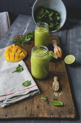 Glasses of spinach smoothie with mango, lime juice and hemp seed - ODF01582