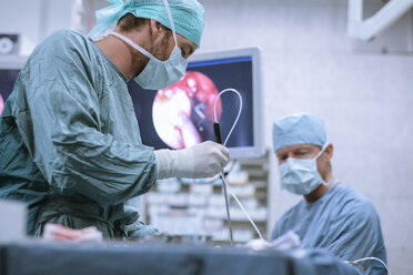 Surgical nurse at work during an operation - MWEF00192